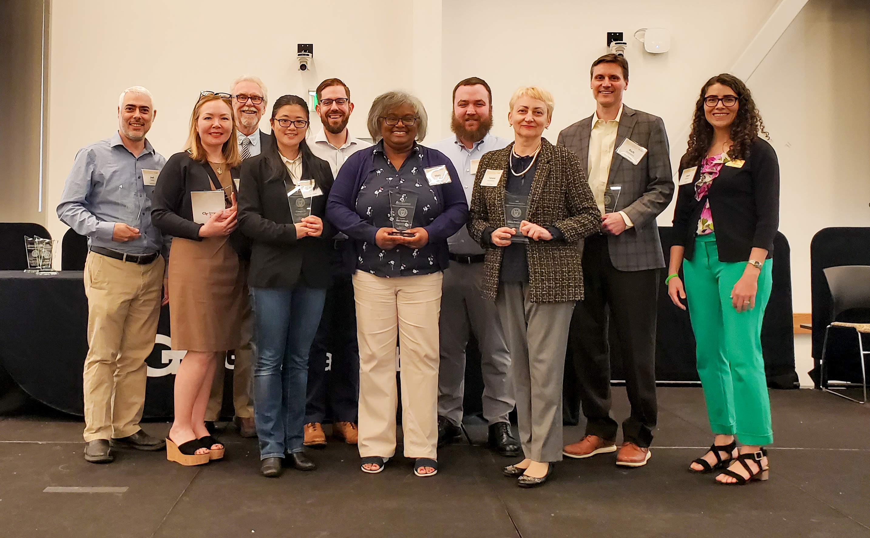 Some of the 2023 winners of the CTL Faculty Teaching Awards pose on stage following the Faculty and Staff Honors Luncheon