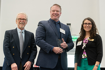 The Center for Teaching and Leanring presents Dr. Adam Decker with the Undergraduate Educator Award during the 2023 Georgia Tech Faculty and Staff Honors Luncheon. 