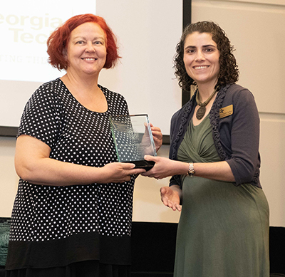 The Center for Teaching and Learning presents Dr. Mary Hudacheck-Buswell with the Educational Partnership Award at the Faculty and Staff Honors Luncheon in 2019.