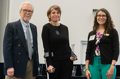 The Center for Teaching and Leanring presents Dr. Pamela Pollet and Dr. Eric Lewis (not pictured) with the Innovation in Co-Curricular Education Award during the 2023 Georgia Tech Faculty and Staff Honors Luncheon. 