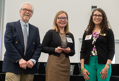 The Center for Teaching and Leanring presents Dr. Aseilia Urmanbetova with the Innovation in Co-Curricular Education Award during the 2023 Georgia Tech Faculty and Staff Honors Luncheon. 