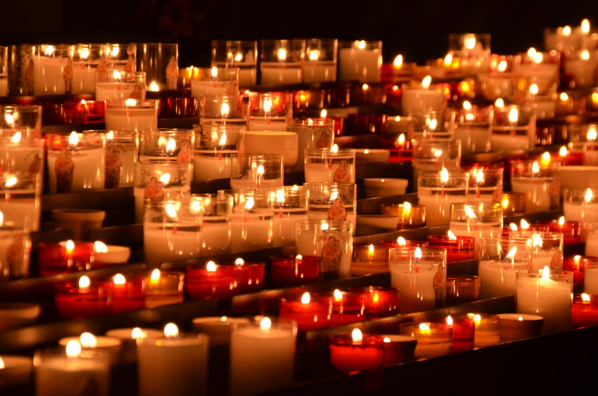 Lit votive candles in remembrance/vigil