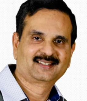 A headshot of Raghu Pucha.